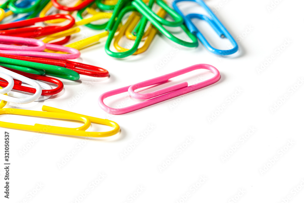 Many multicolored paper clips on a white background. Many multicolored paper clips on a white background.