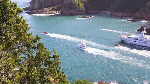 Yacht MV Katharine leaves Knysna, South Africa on a sunny summer day photo