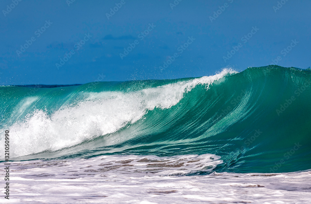 Fototapeta premium Ocean Wave Closeup Water. Ocean wave closeup detail of upright crashing hollow breaking water. energy power of nature.