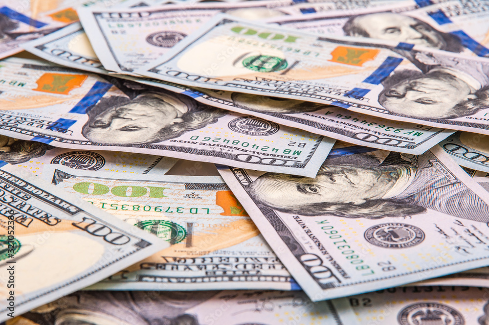 The background of scattered hundred dollar bills. The background of scattered hundred dollar bills.