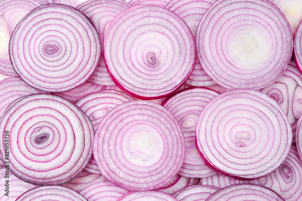 Onion slices as a background. Top view. Onion slices as a background. Top view.