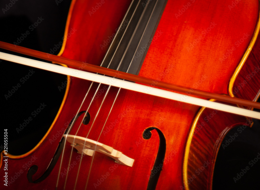 Beautiful Cello Close Up, Bridge, F Holes, Strings, and Bow Beautiful Cello Close Up, Bridge, F Holes, Strings, and Bow