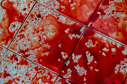 Blood spatter on dirty floor for scary crime scene .