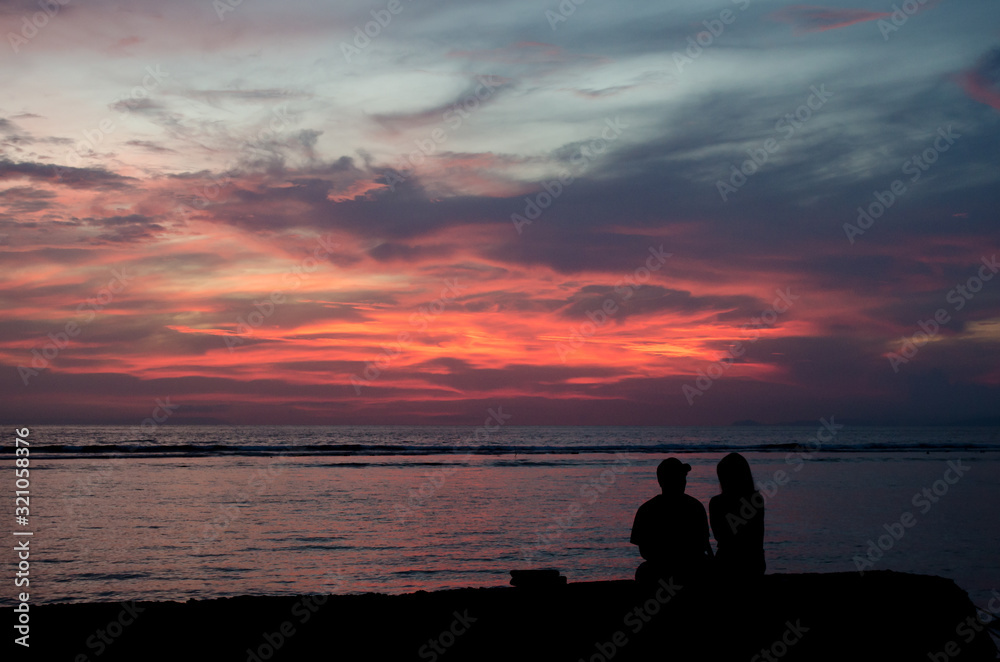 Silhouette of a couple in love at sunset Silhouette of a couple in love at sunset