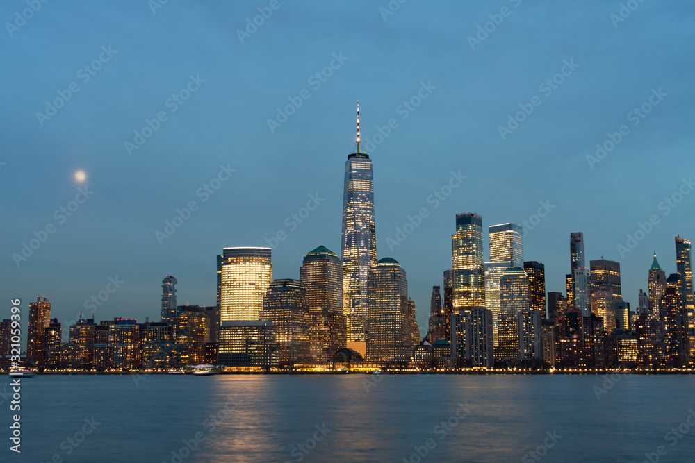Lower Manhattan New York City Skyline at Night with the Moon