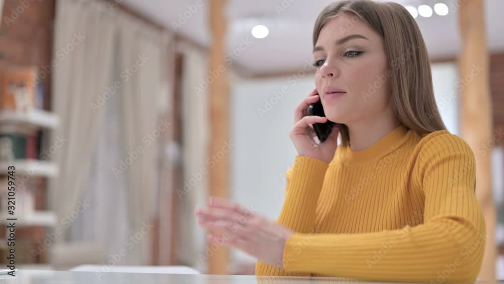 Happy Creative Young Woman Talking on Smartphone in Office Happy Creative Young Woman Talking on Smartphone in Office