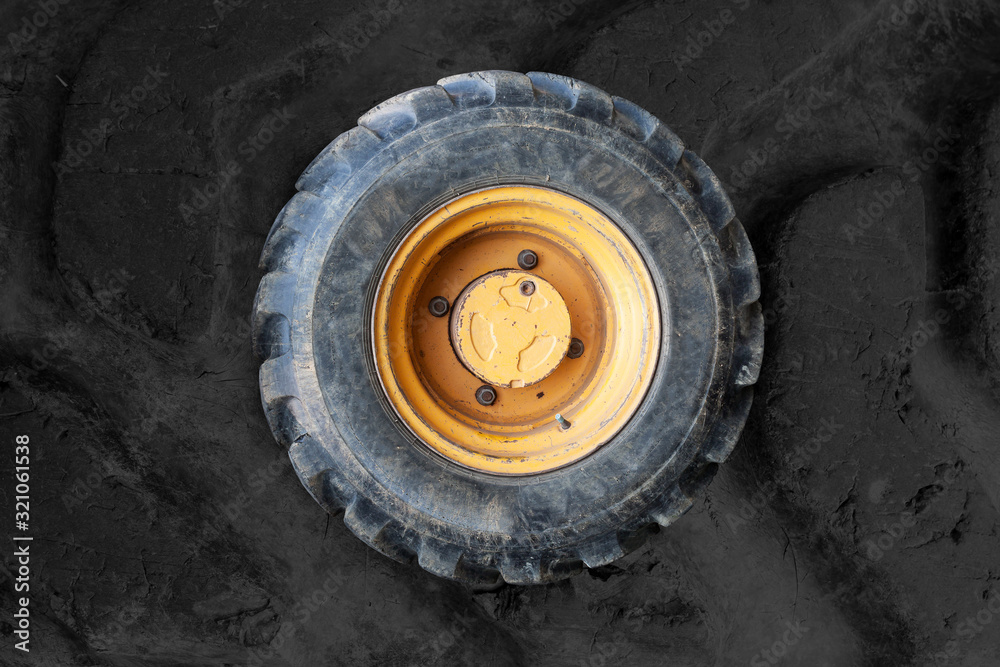 Old Tractor wheel isolated on background Old Tractor wheel isolated on background