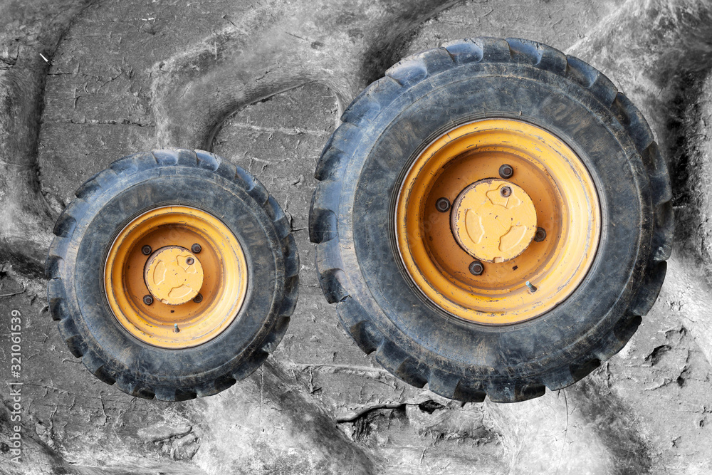 Old Tractor wheel isolated on background Old Tractor wheel isolated on background