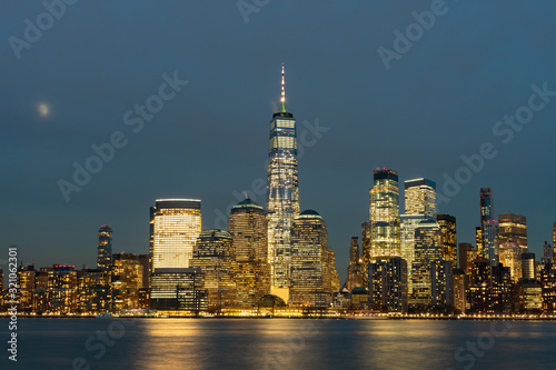 Lower Manhattan New York City Skyline at Night with the Moon