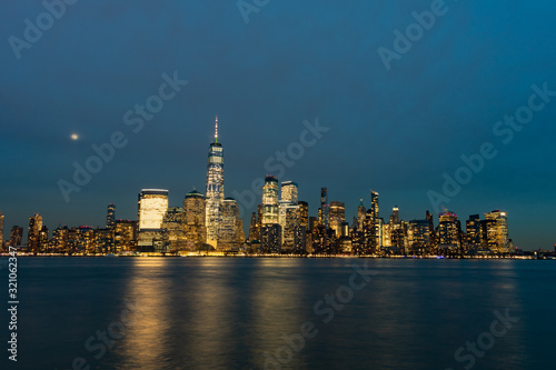 Lower Manhattan New York City Skyline at Night with the Moon © James