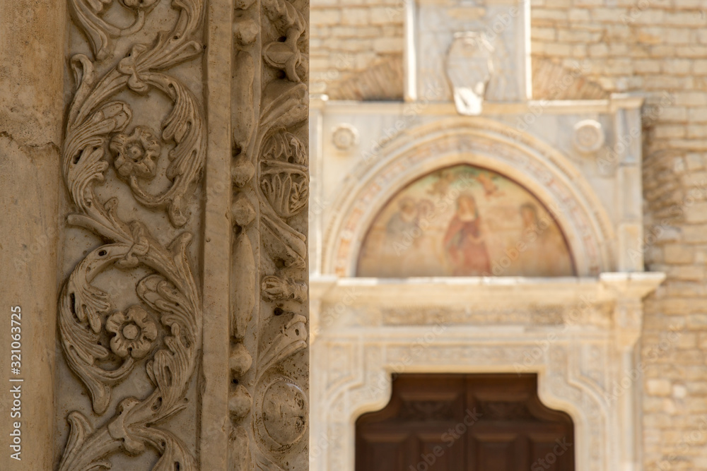 particular friezes and in the background the ancient abbey