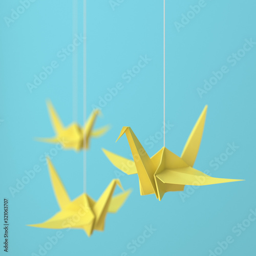 Fototapeta Naklejka Na Ścianę i Meble -  Tree yellow origami cranes on blue background.3d rendering