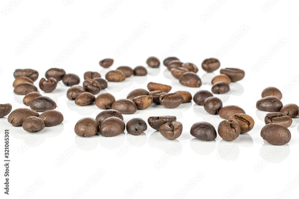 Lot of whole disordered fresh coffee bean isolated on white background Lot of whole disordered fresh coffee bean isolated on white background