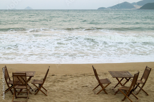 wooden cafe tables by the sea