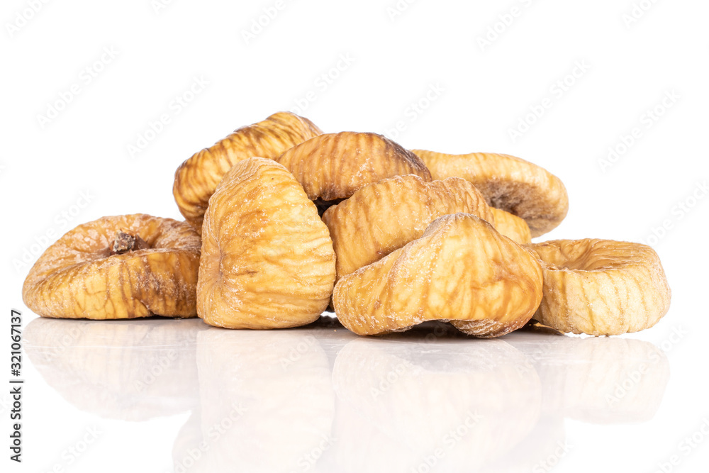 Lot of whole dried fig heap isolated on white background