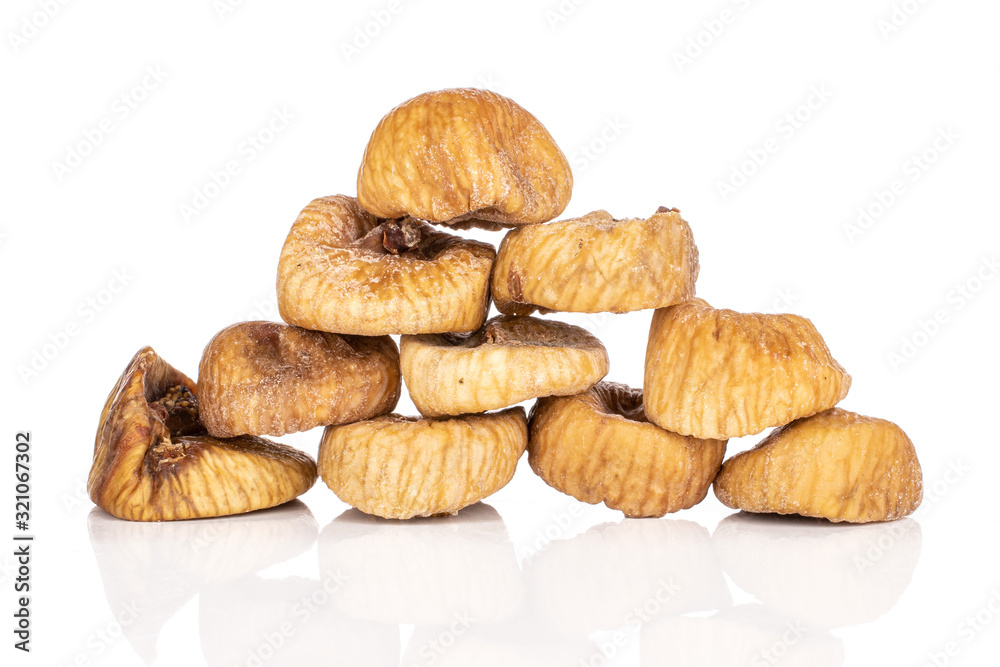 Lot of whole dried fig isolated on white background