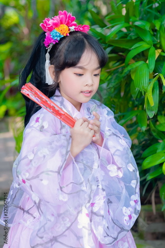 asian little girl Wearing yukata in graden