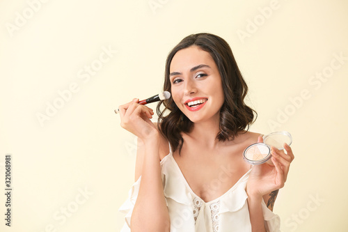 Beautiful young woman apply...