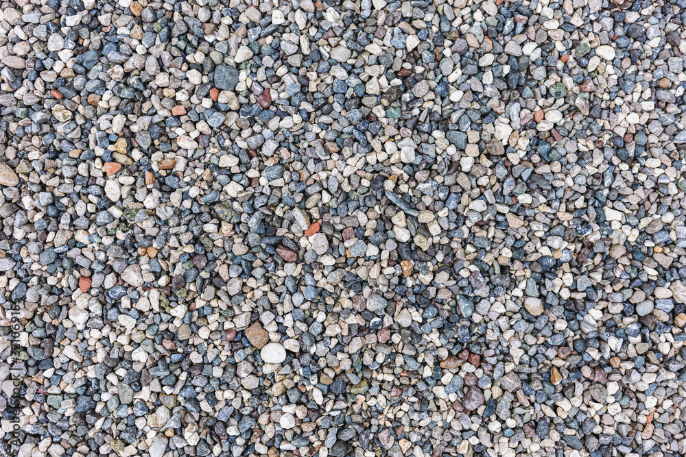 Closeup top view photography of grey small pebble stones at sea beach. Flatlay abstract organic background. Closeup top view photography of grey small pebble stones at sea beach. Flatlay abstract organic background.