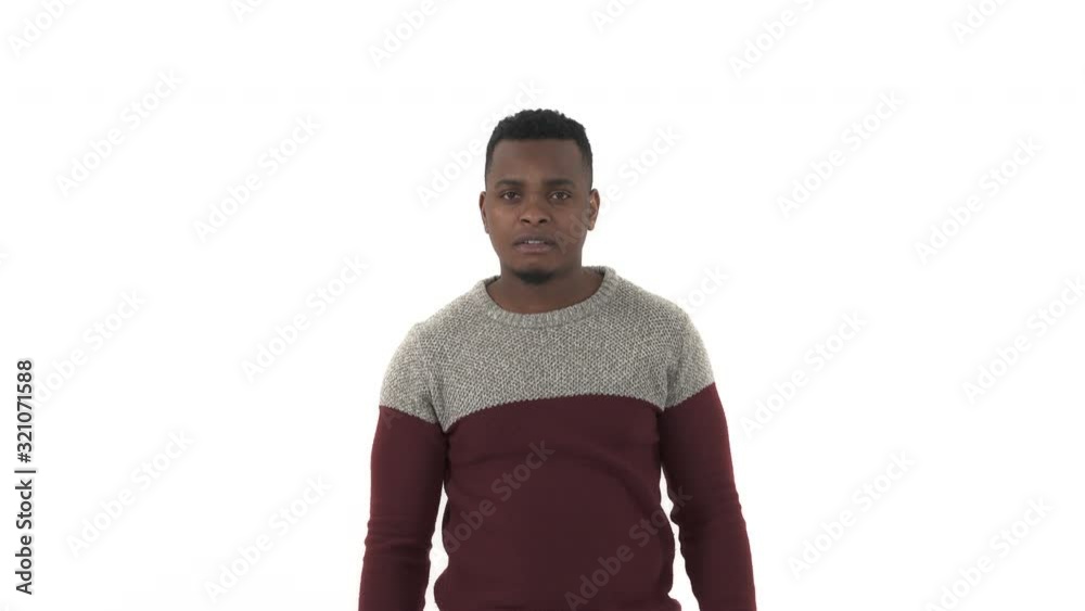 Close-up portrait of a young man pointing with index finger to the camera and to you. Hand sign, confident gesture. Isolated, on white background Close-up portrait of a young man pointing with index finger to the camera and to you. Hand sign, confident gesture. Isolated, on white background