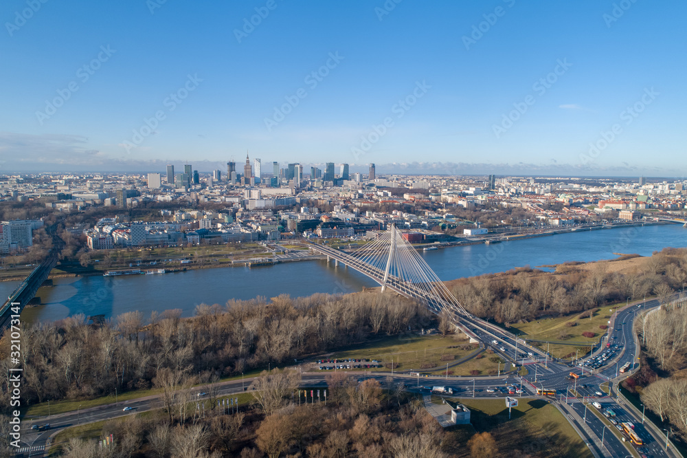 WARSAW. POLAND. Bridge and panorama of beautiful Warsaw city in the morning sun. Vistula River. 