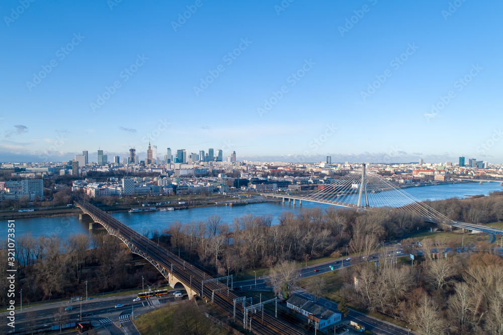 WARSAW. POLAND. Bridge and panorama of beautiful Warsaw city in the morning sun. Vistula River. 