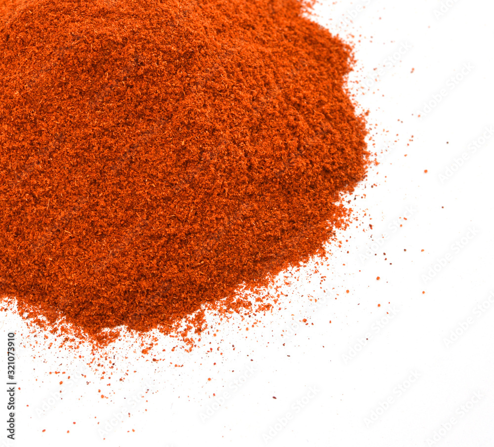 Powdered red pepper pile from top on white background Powdered red pepper pile from top on white background