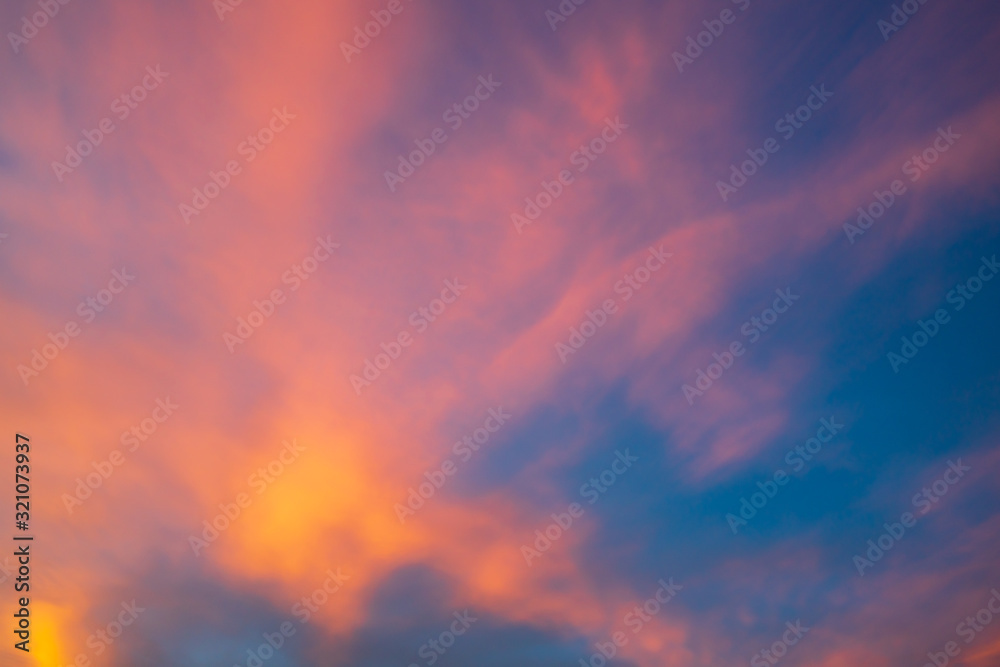 Colorful dramatic sky with orange clouds