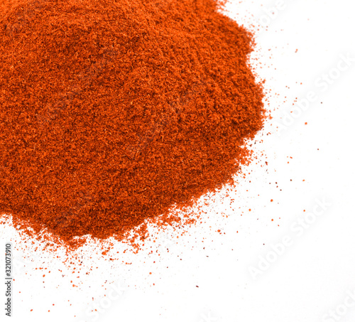 Powdered red pepper pile from top on white background