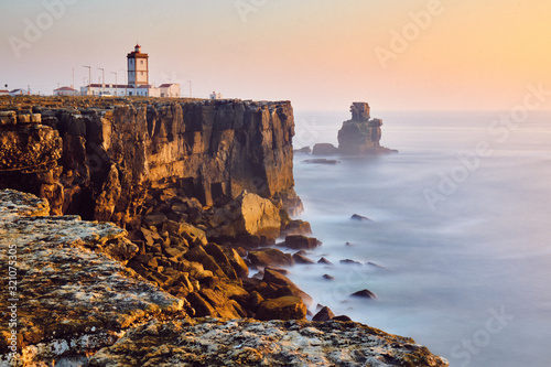 View Of Lighthouse And Sea In Peniche Portugal At Sunset photo