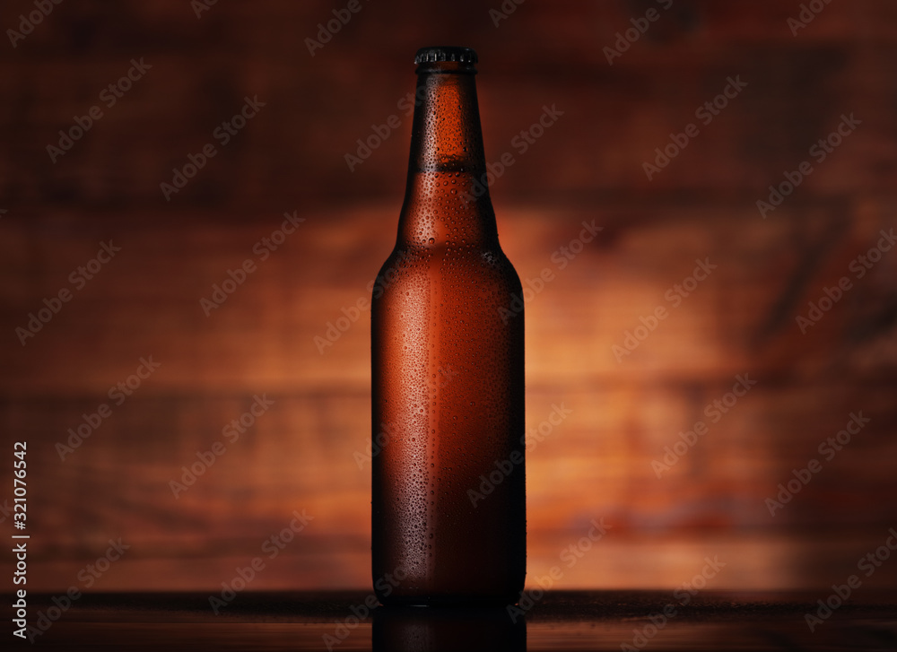 brown full bottle with beer