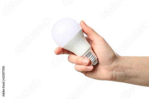 Hand holding light bulb, isolated on white background
