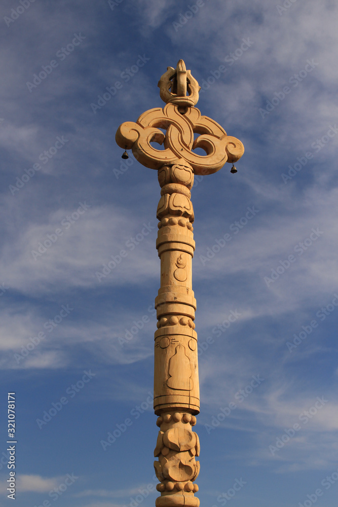 Kyzyl, Russia - August 14, 2015: mystical religious shamanistic statue made of wood. Pagan image carve