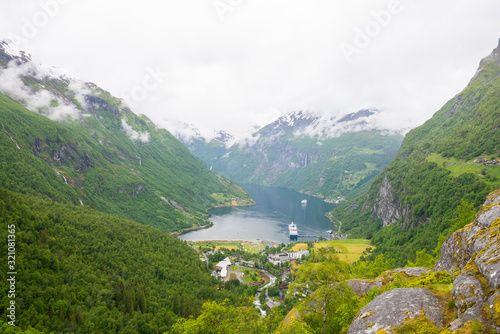 Geiranger / Norway 06.29.2015Panoramic view of Geiranger Fjord on cloudy day