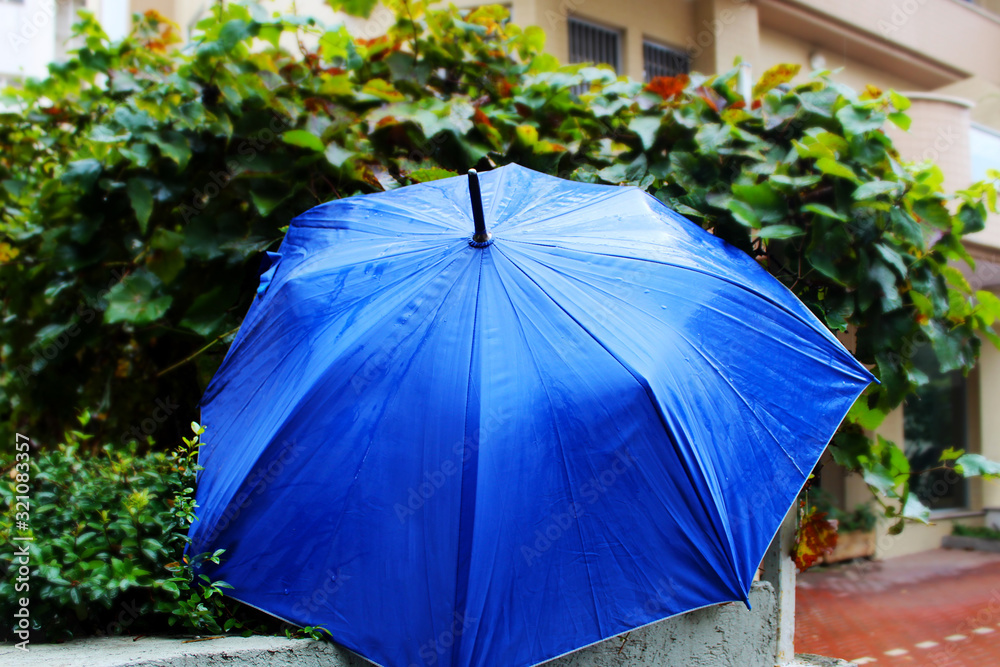 Umbrella wet from raindrops. Winter in Israel, rain, floods, rainy weather