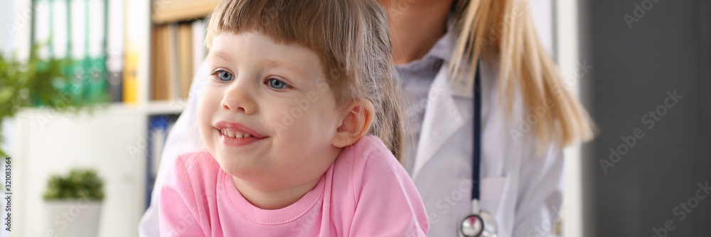 Cute little girl visiting family doctor office portrait Cute little girl visiting family doctor office portrait