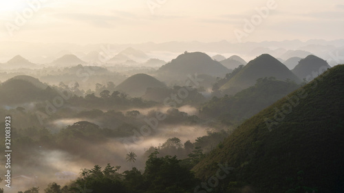 Panorama view of chocolate hills in Bohol, philippines at sunrise, mist fog, carmen, Asia photo