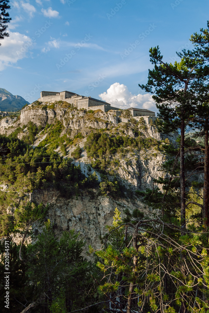 Fototapeta premium View of Fort Victor-Emmanuel. Dominating the Arc Valley , the rocky foothills of Esseillon, a natural defensive barrier a hundred metres high, blocks the access to the Haute-Maurienne Valley.