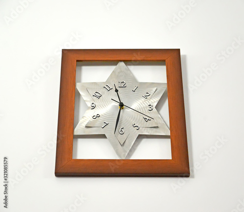 Wall clock with dial shaped like David 's star photo