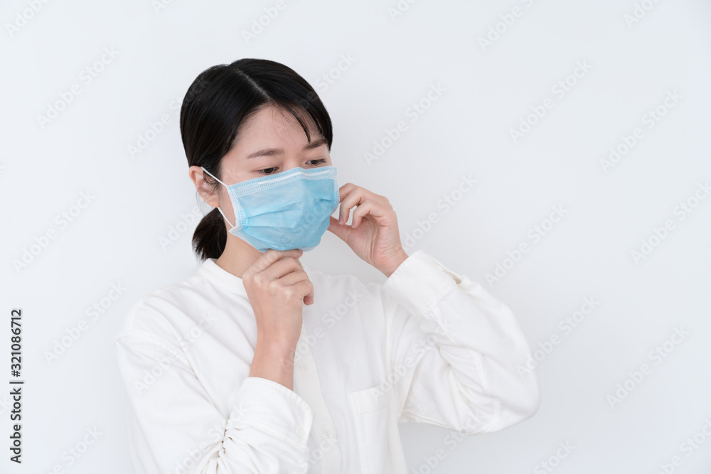 Asian woman wearing a mouth protection to prevent getting sick Asian woman wearing a mouth protection to prevent getting sick