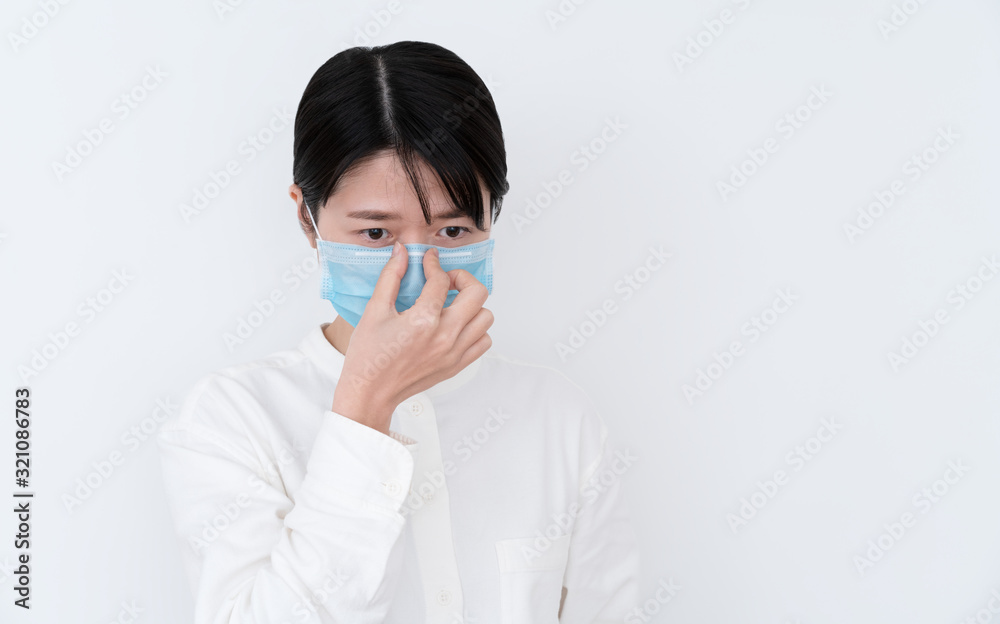 Asian woman wearing a mouth protection to prevent getting sick