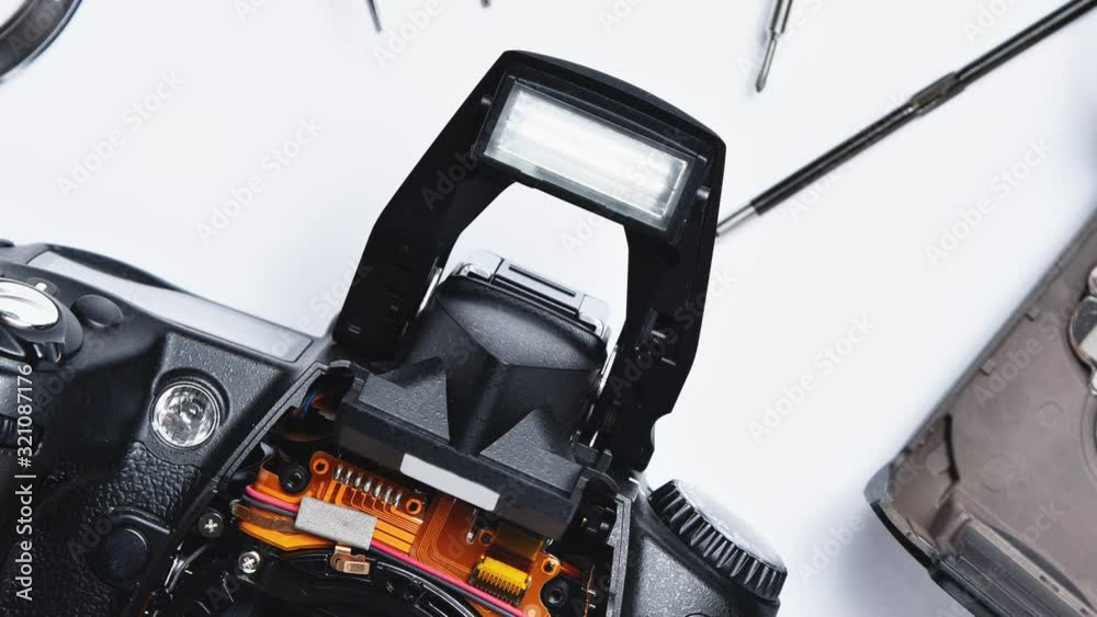 Electronics repair in a service center, disassembled camera. Electronics repair in a service center, disassembled camera.