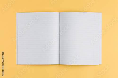 notebook on a yellow background and top view