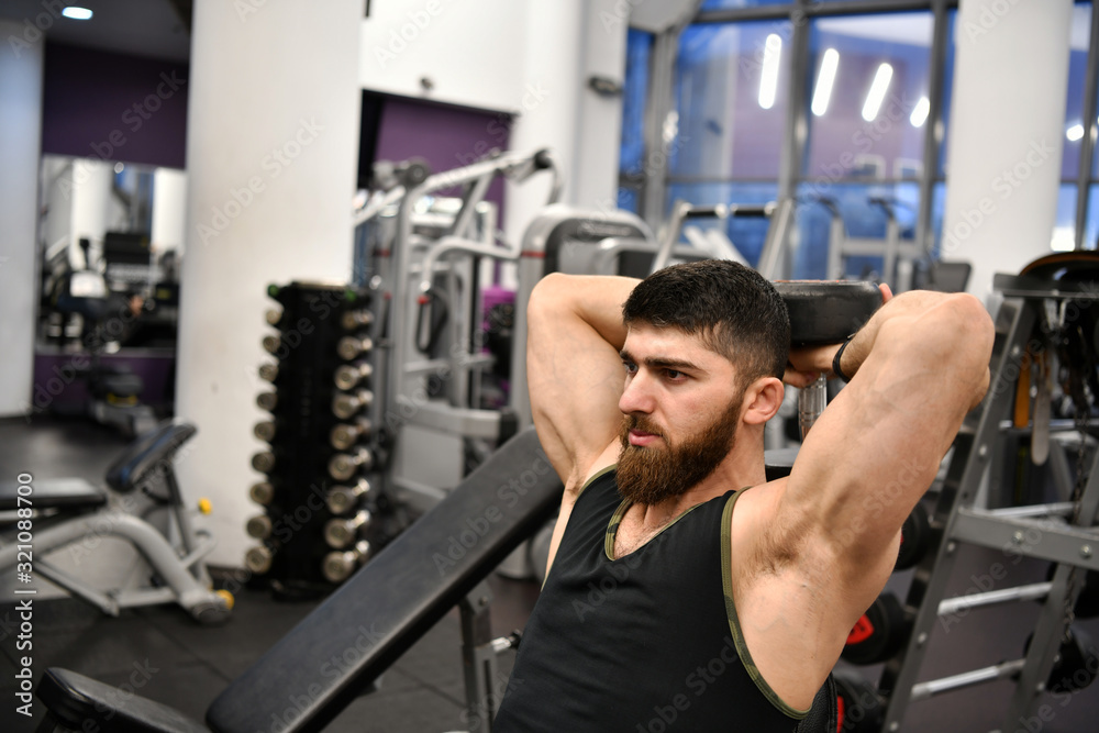male athlete goes in for sports in the gym male athlete goes in for sports in the gym