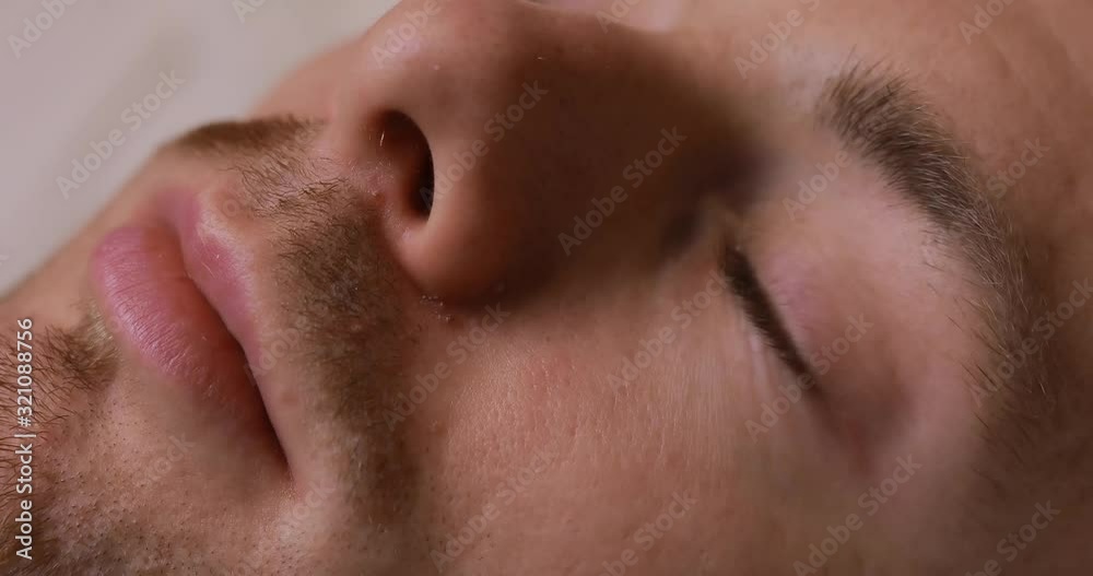 Man putting eye drops close up Man putting eye drops close up