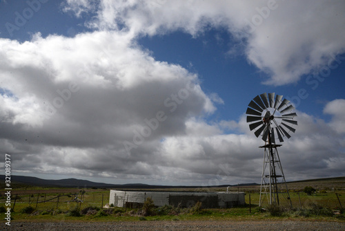 A windmill alongside a water tank