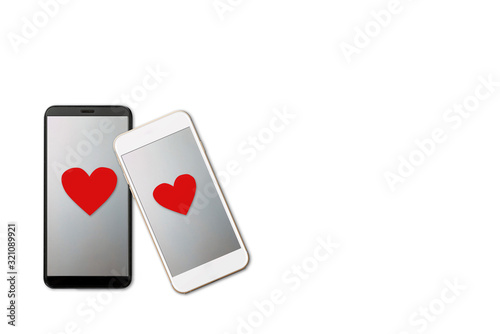 Valentine day concept, two smartphones vith red heart shape on screen, isolated on white background