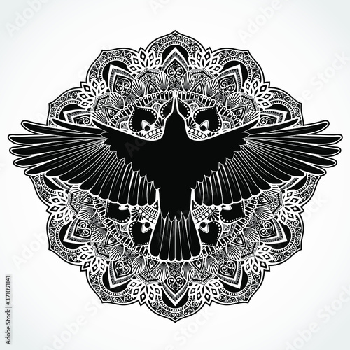 ornamental mandala background with silhouette crow