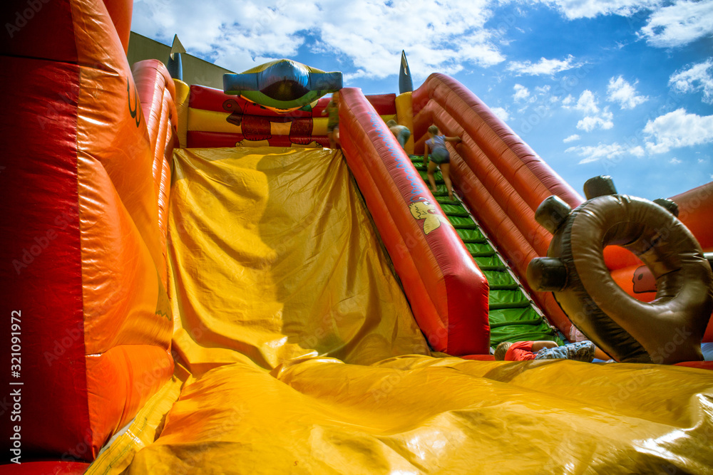 Kids on inflatable slides