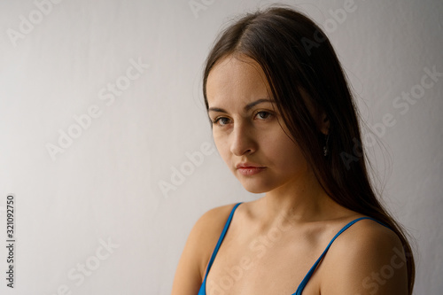 close-up portrait of a sweet sad young woman